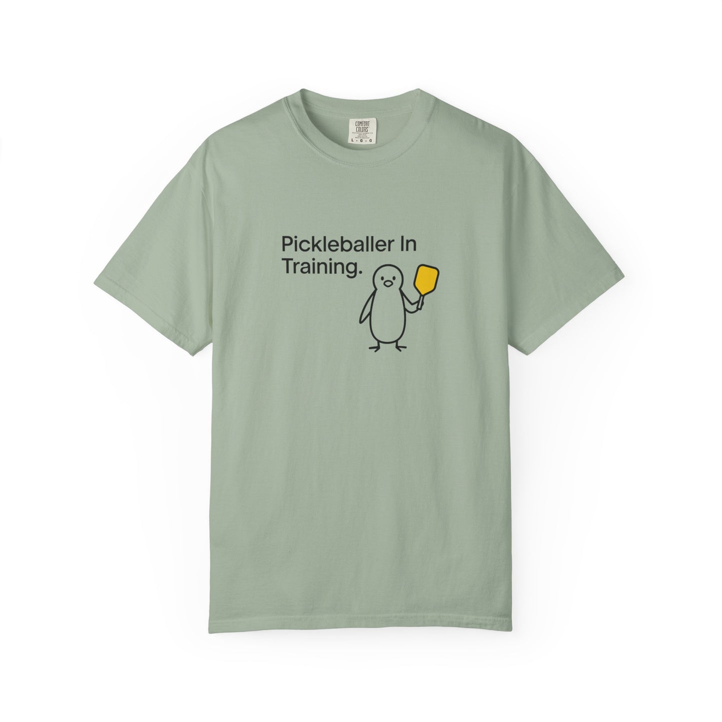 Pickleballer in Training T-Shirt | Cute Penguin Holding Paddle Design