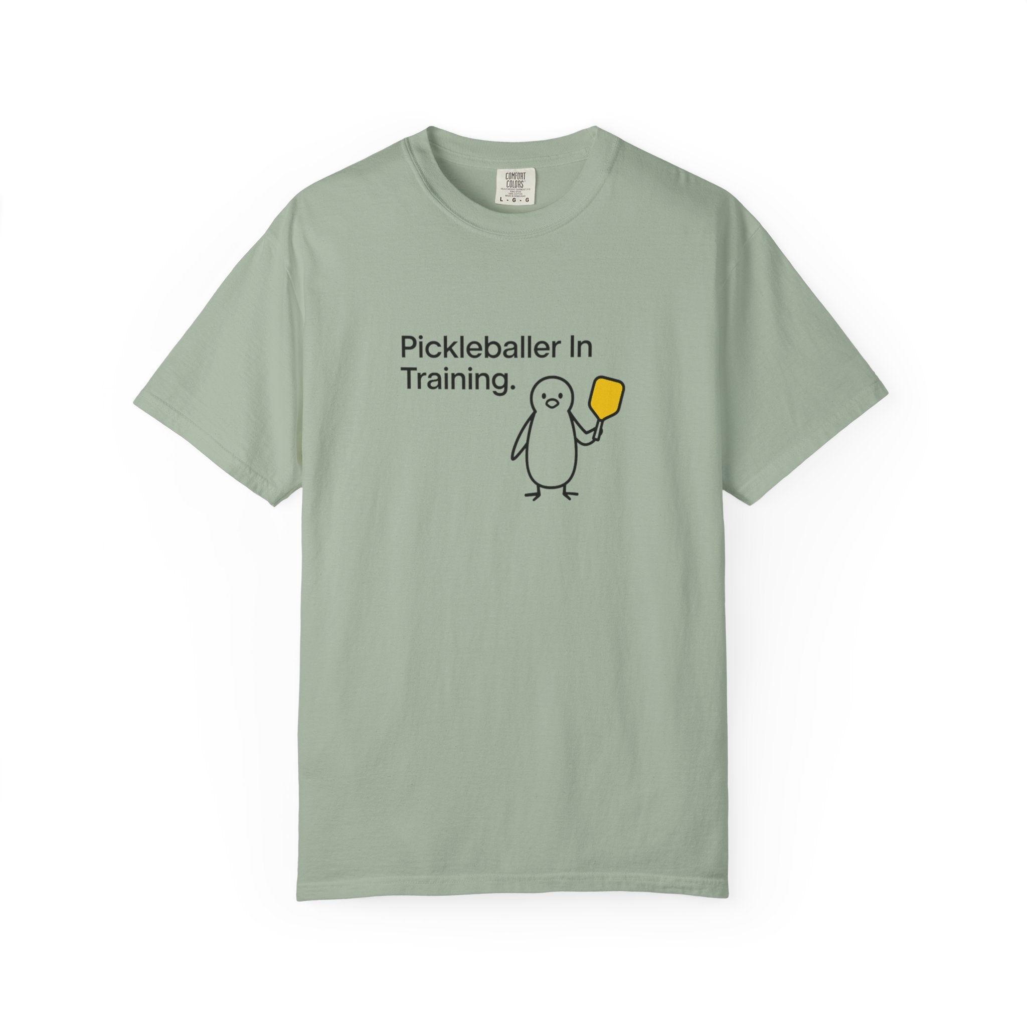 Pickleballer in Training T-Shirt | Cute Penguin Holding Paddle Design