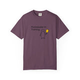 Pickleballer in Training T-Shirt | Cute Penguin Holding Paddle Design