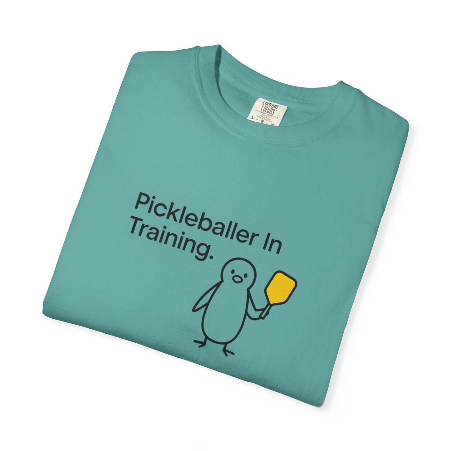 Pickleballer in Training T-Shirt | Cute Penguin Holding Paddle Design