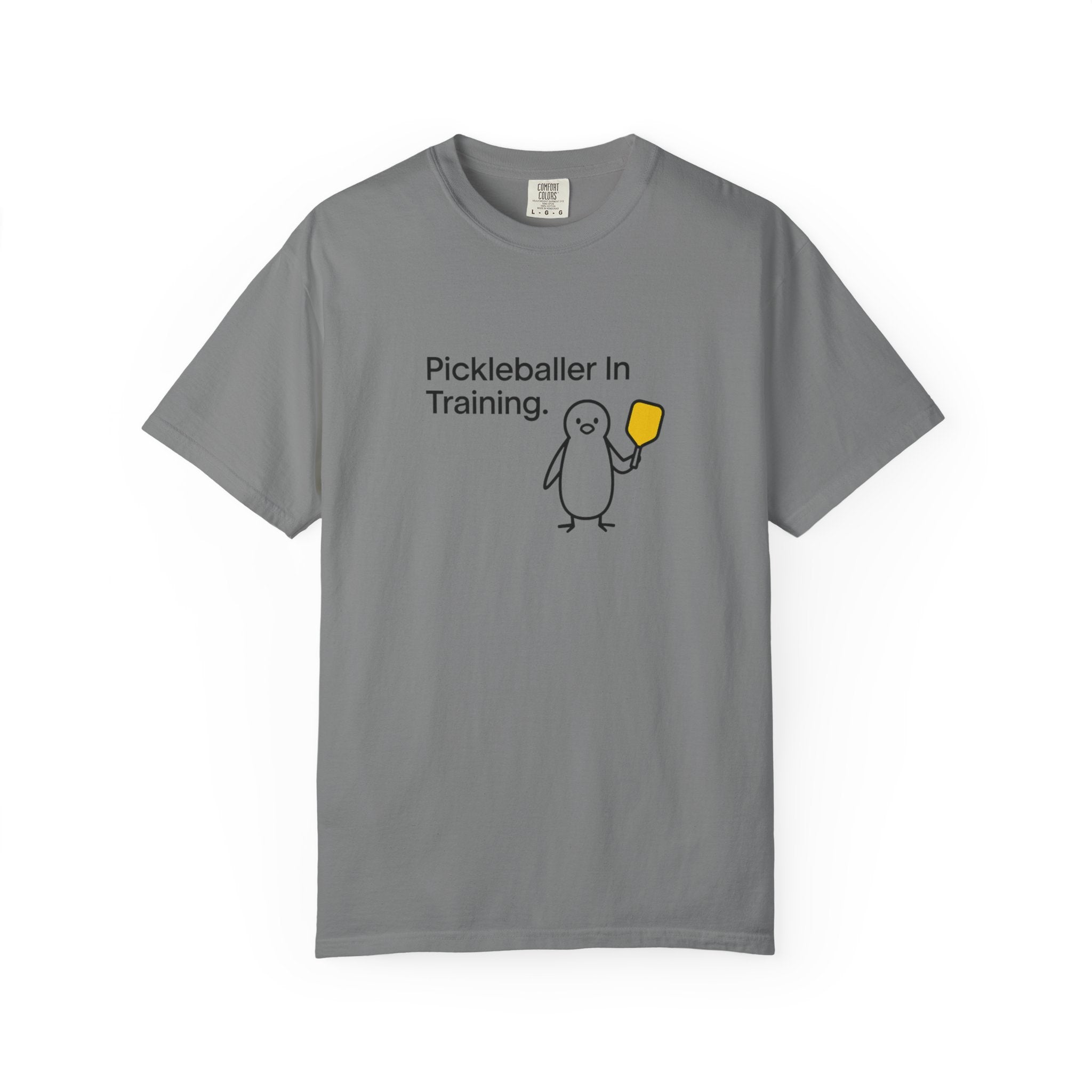 Pickleballer in Training T-Shirt | Cute Penguin Holding Paddle Design