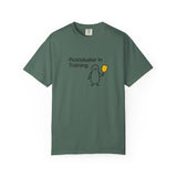 Pickleballer in Training T-Shirt | Cute Penguin Holding Paddle Design