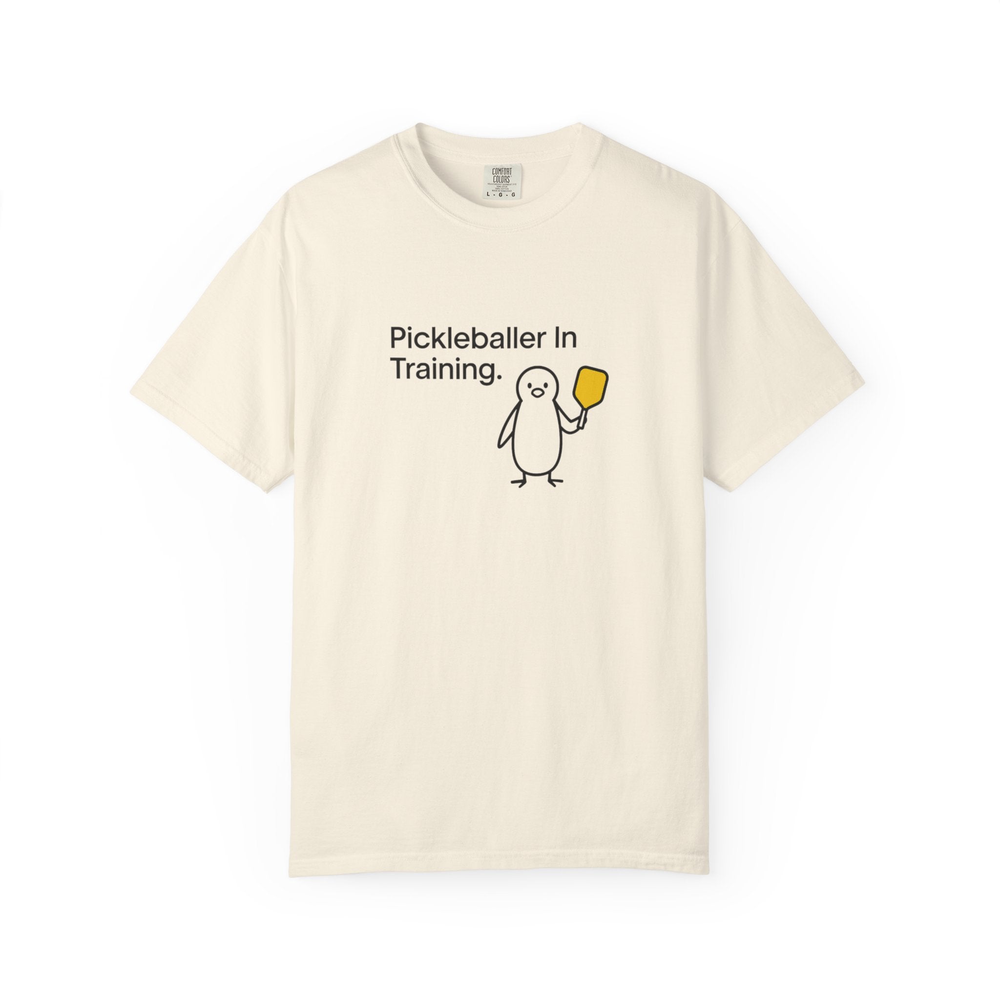 Pickleballer in Training T-Shirt | Cute Penguin Holding Paddle Design
