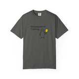 Pickleballer in Training T-Shirt | Cute Penguin Holding Paddle Design