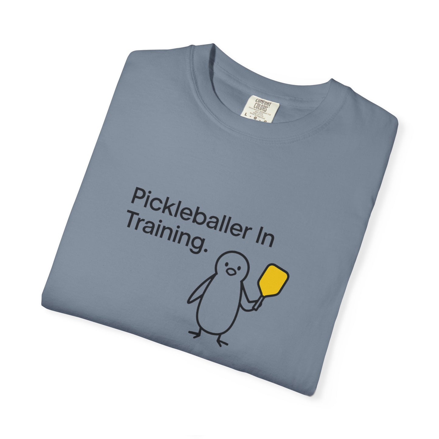 Pickleballer in Training T-Shirt | Cute Penguin Holding Paddle Design