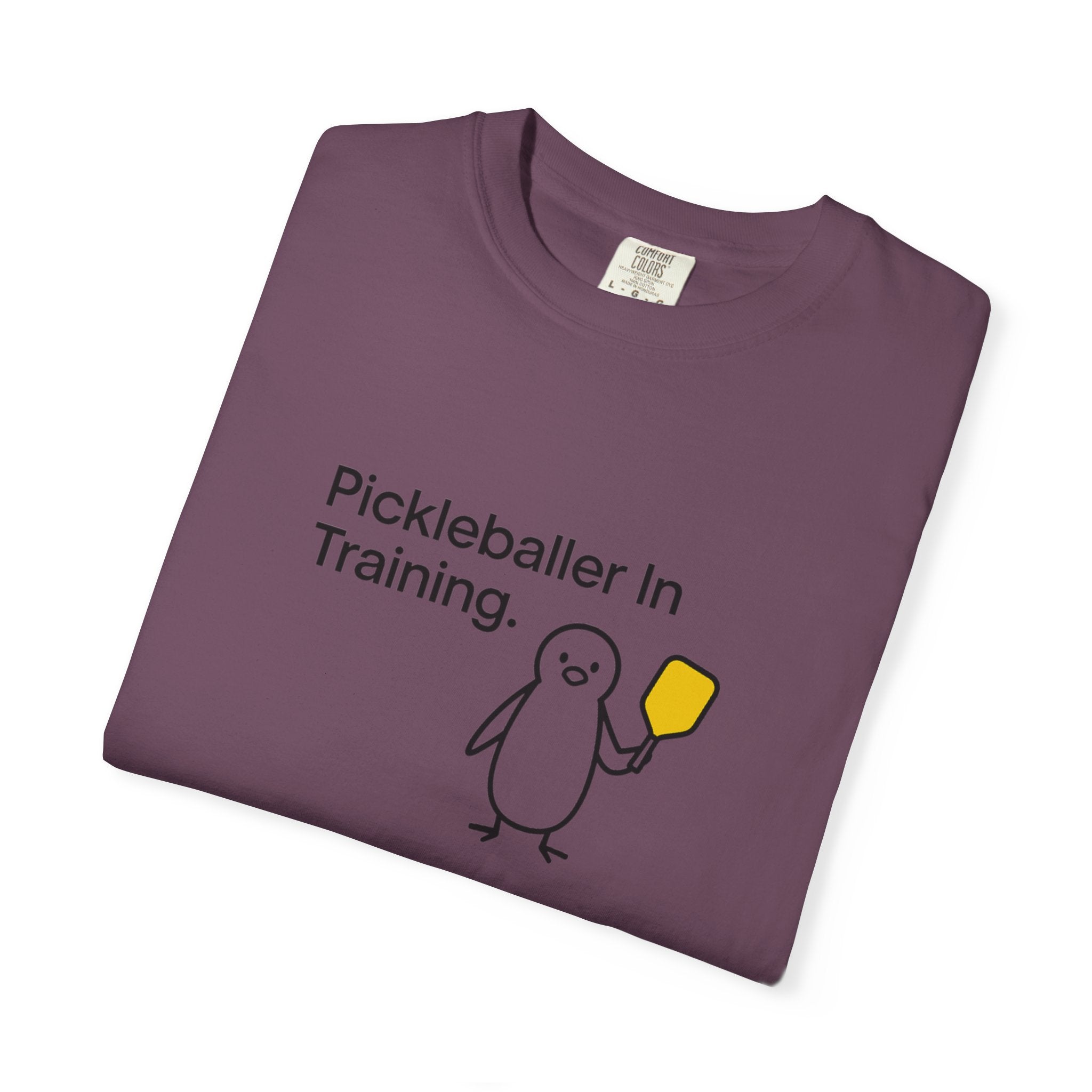 Pickleballer in Training T-Shirt | Cute Penguin Holding Paddle Design