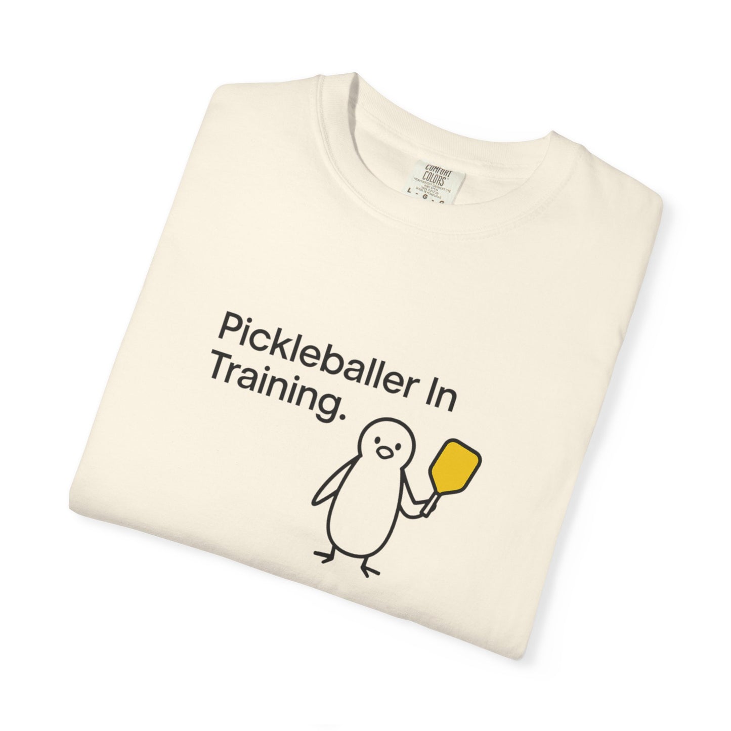Pickleballer in Training T-Shirt | Cute Penguin Holding Paddle Design