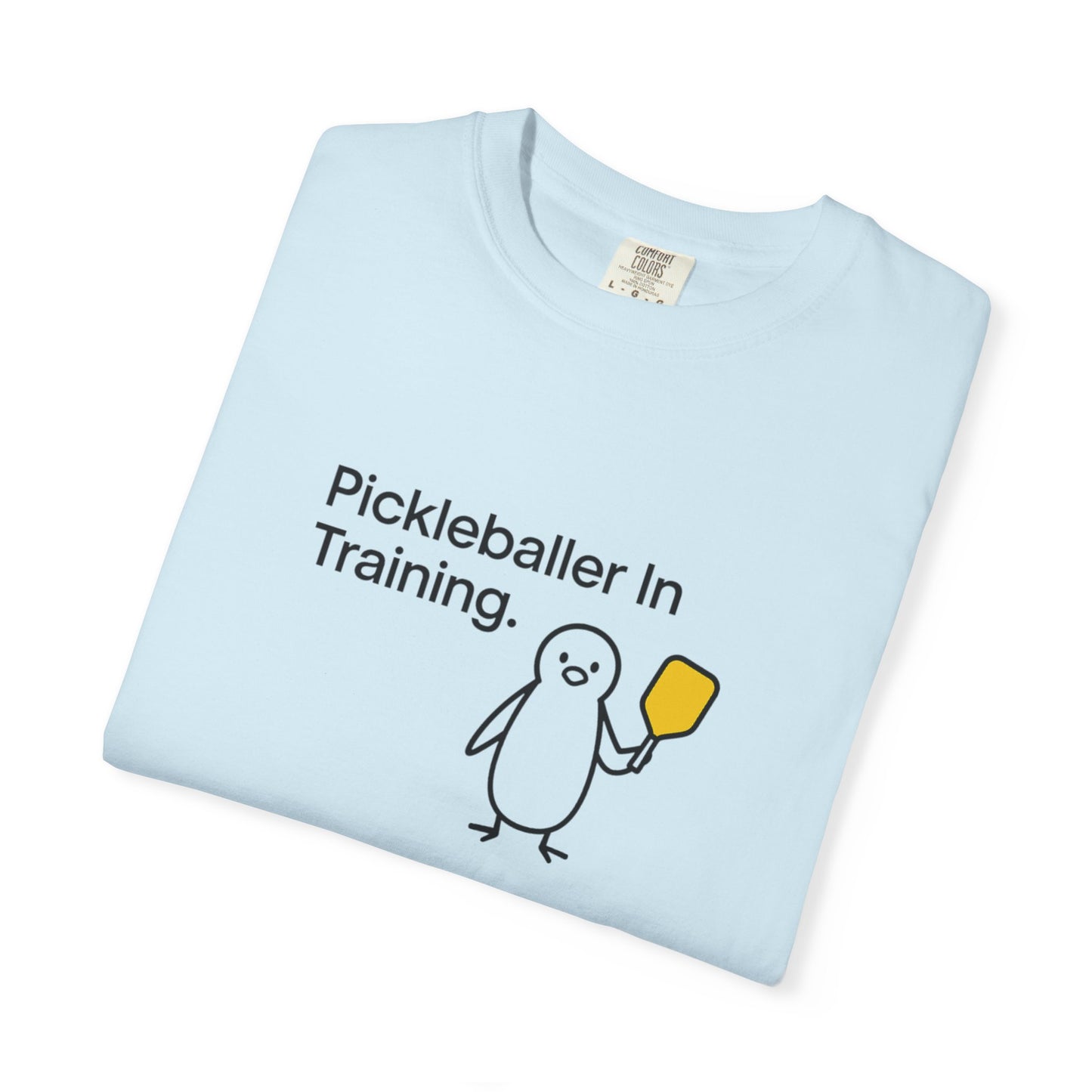 Pickleballer in Training T-Shirt | Cute Penguin Holding Paddle Design