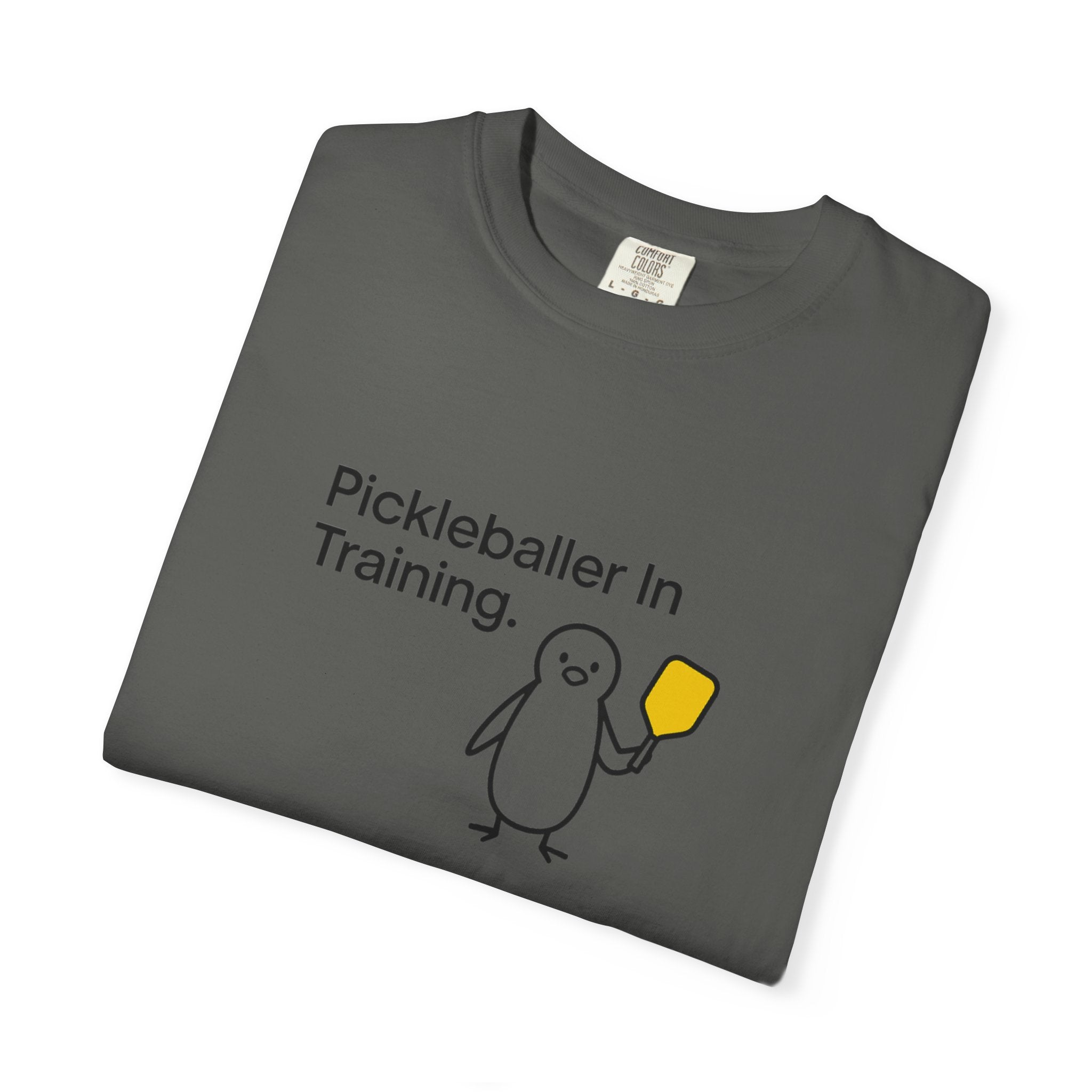 Pickleballer in Training T-Shirt | Cute Penguin Holding Paddle Design