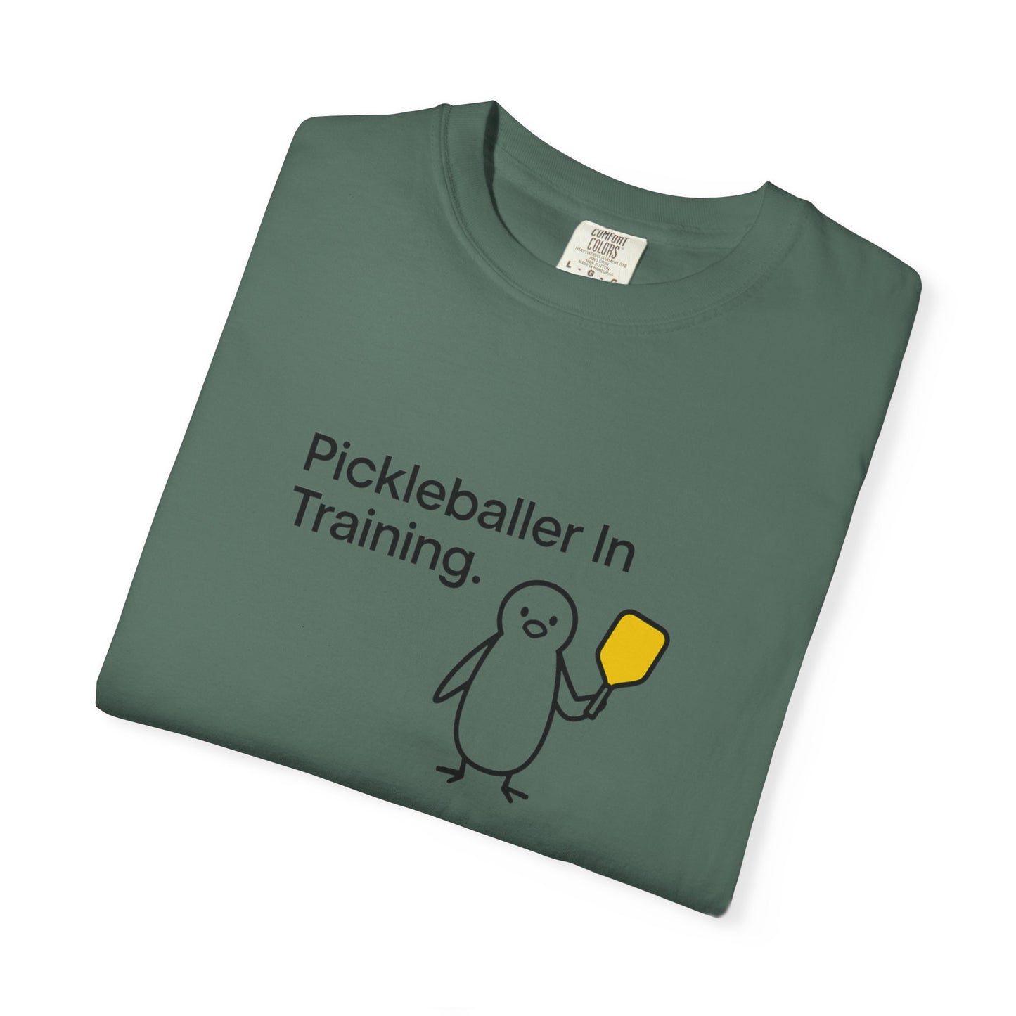 Pickleballer in Training T-Shirt | Cute Penguin Holding Paddle Design