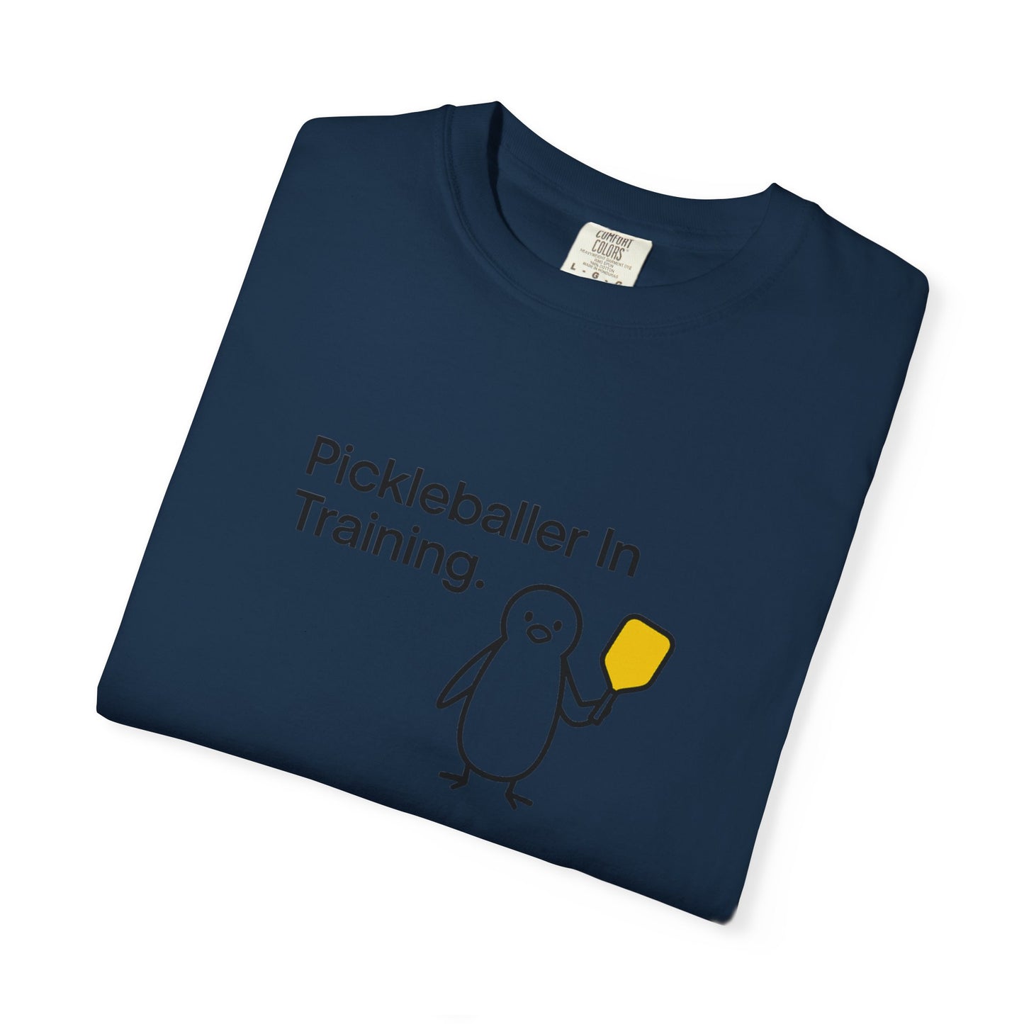 Pickleballer in Training T-Shirt | Cute Penguin Holding Paddle Design