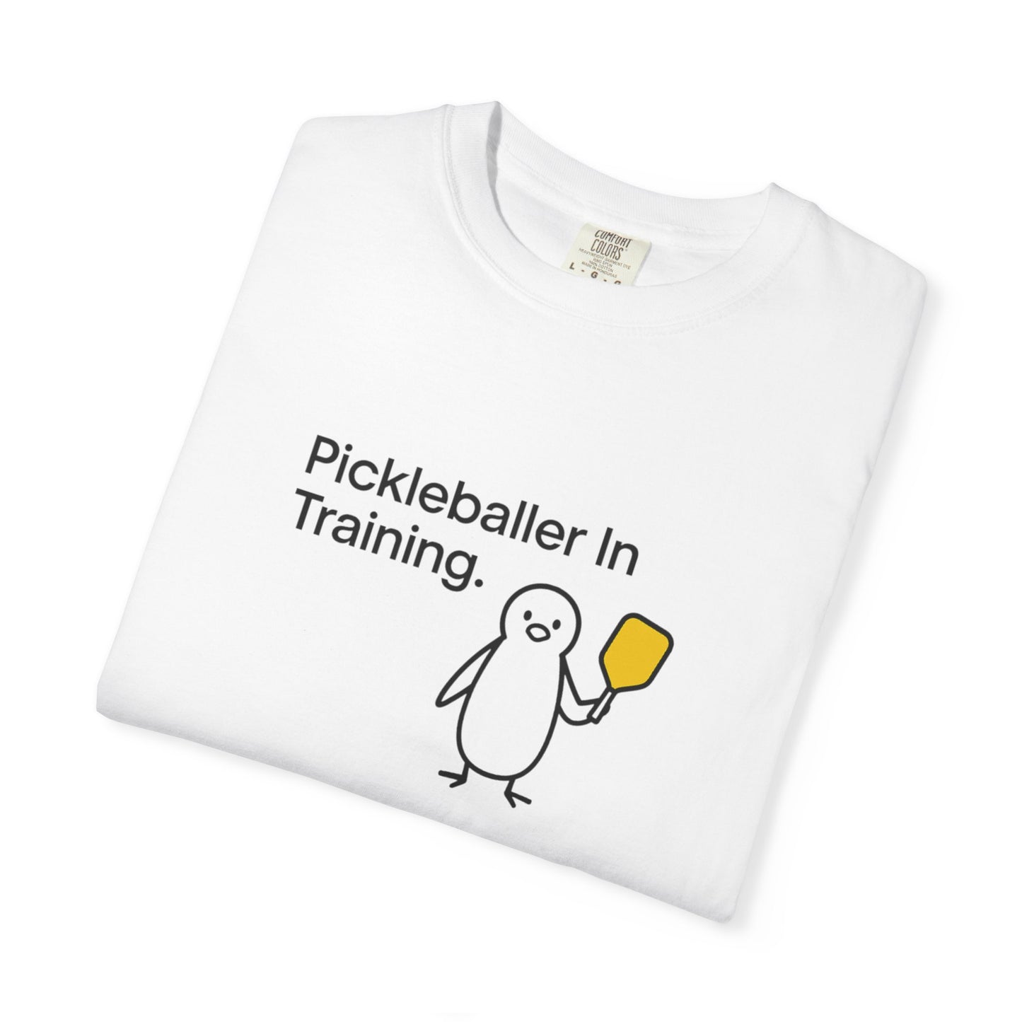 Pickleballer in Training T-Shirt | Cute Penguin Holding Paddle Design